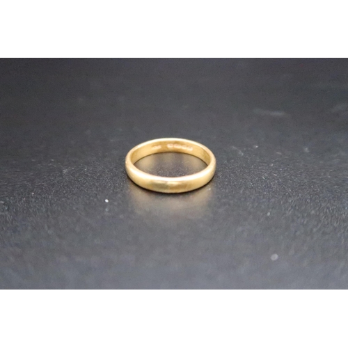 133 - A 22ct yellow gold wedding band - ring size M/N - approx weight 3.7 grams