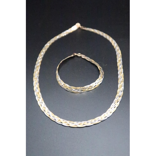 136 - A 9ct gold tri colour woven gold necklace and bracelet set. Weight 8.07 grams.