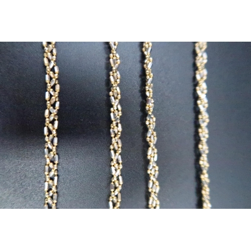 137 - A 9ct gold bi colour woven bead necklace and bracelet set. Weight 15.65 grams