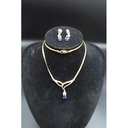 139 - A 9ct gold sapphire and diamond necklace and bracelet set. The necklace designed as an oval sapphire... 