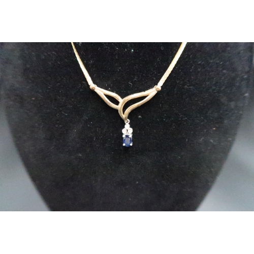 139 - A 9ct gold sapphire and diamond necklace and bracelet set. The necklace designed as an oval sapphire... 