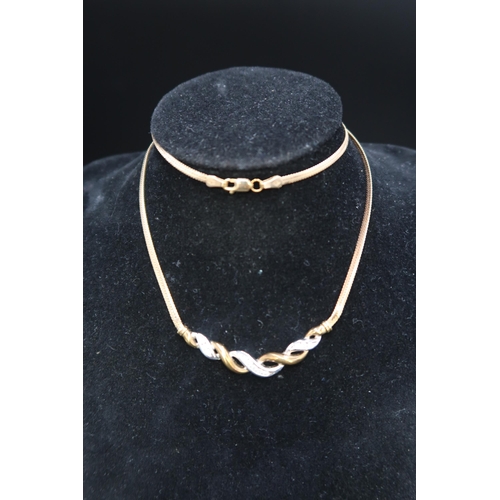 141 - A 9ct bi colour gold diamond set necklet. Weight 6.94 grams.