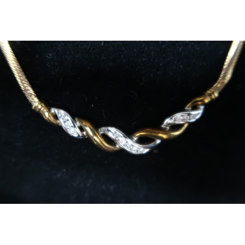 141 - A 9ct bi colour gold diamond set necklet. Weight 6.94 grams.