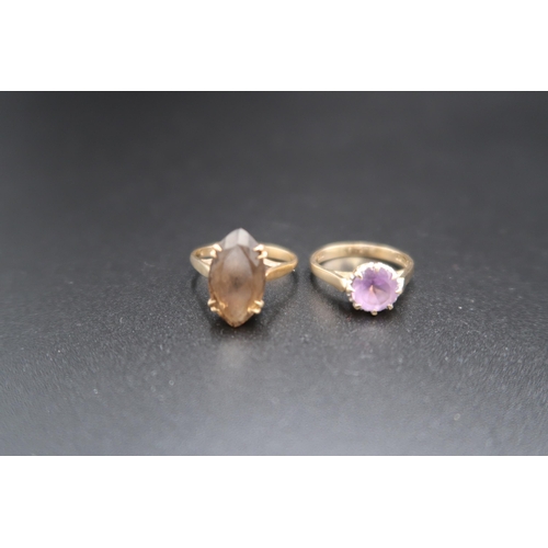 150 - Two 9ct gold dress rings. One set with a marquise shape smokey quartz, size Q 1/2. One set with a ci... 