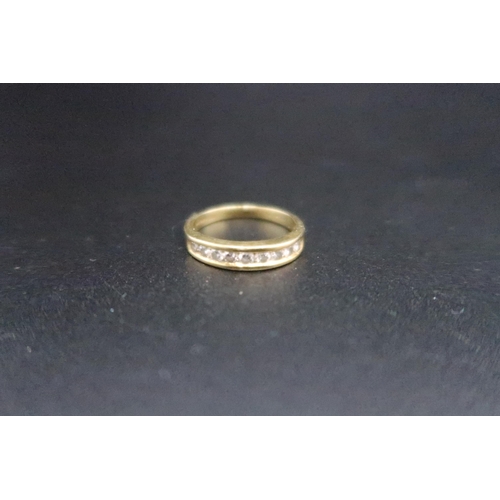 153 - An 18ct gold brilliant cut diamond half eternity ring. Estimated 0.50ct. Size O. Weight 3.55 grams.