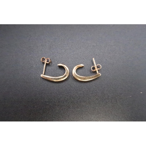 156 - A pair of 9ct gold brilliant cut diamond ear cuffs. Weight 3.68 grams.