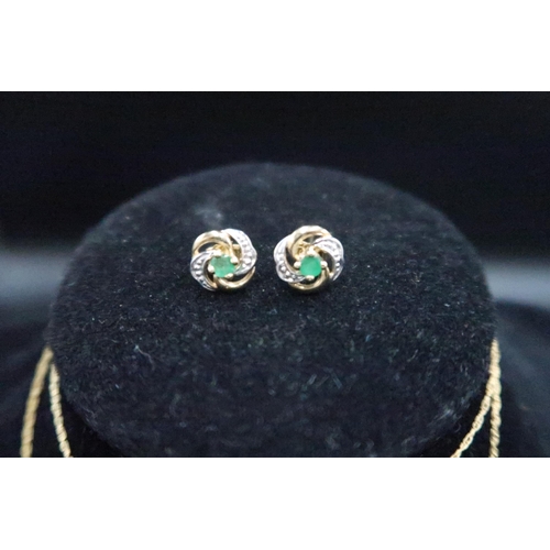 161 - An emerald and diamond pendant and earring set. Stamped 9K. Weight 1.83 grams