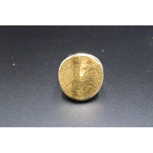 166 - A coin ring. Tests 14 and 22ct gold. Size K. Weight 10.45 grams