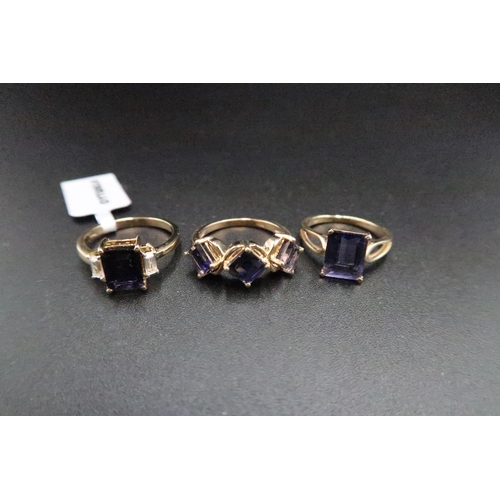 178 - Three 9ct gold iolite rings. To include a single stone, size K, a three stone size M and a single st... 