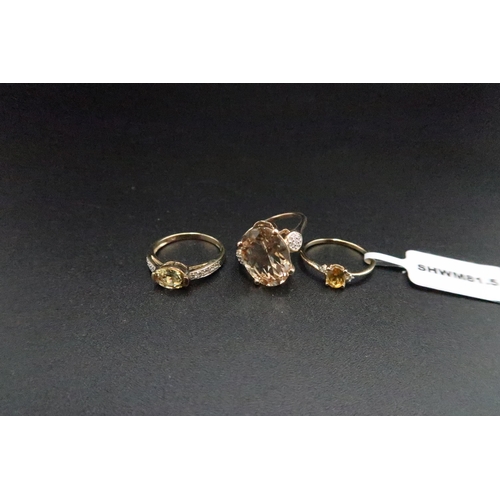 179 - Three 9ct gold dress rings. To include an oval sphene and diamond three stone, size J 1/2. And oval ... 