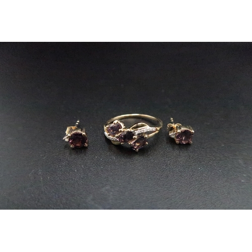 181 - A 9ct gold pink spinel and diamond crossover ring. Size M. A pair of similar ear studs. Weight 2.91 ... 