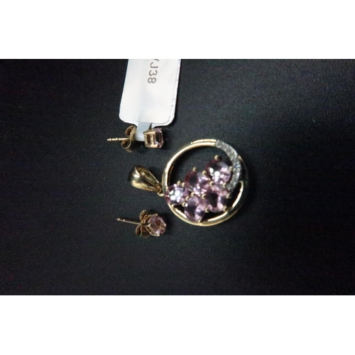 182 - A 9ct gold pink spinel and diamond circle pendant. Together with a pair of pink spinel ear studs. We... 