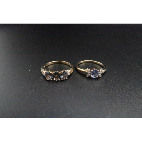 183 - Two 9ct gold blue spinel and diamond rings. To include a three stone size M, a single stone size M. ... 