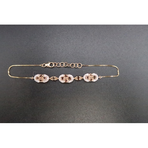 188 - A 9ct gold Andalusite and diamond cluster bracelet. Weight 5.21 grams