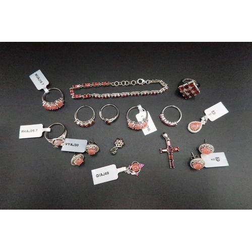 197 - A group of silver jewellery set with rhodochrosite and garnet. To include seven rings, four pendants... 