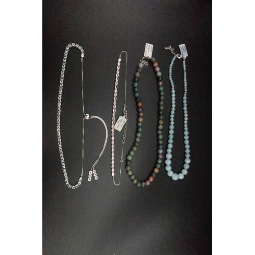 200 - A group of necklaces to include aquamarine and chalcedony beads. Together with aquamarine and goshen... 