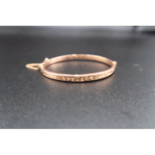 211 - A child's 9ct gold christening bangle, foliate engraved, hallmarked, but marks a little worn, 2.9g, ... 