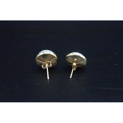 216 - A pair of blister pearl ear studs set in possibly 9ct gold - diameter of pearls approx 14mm