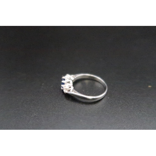 225 - An 18ct white gold diamond and sapphire three stone ring size M - weight approx 2.8 grams