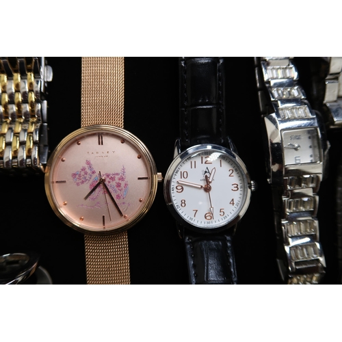 322 - A large group of costume watches including a Philip Mercier quartz example and a Radley watch.