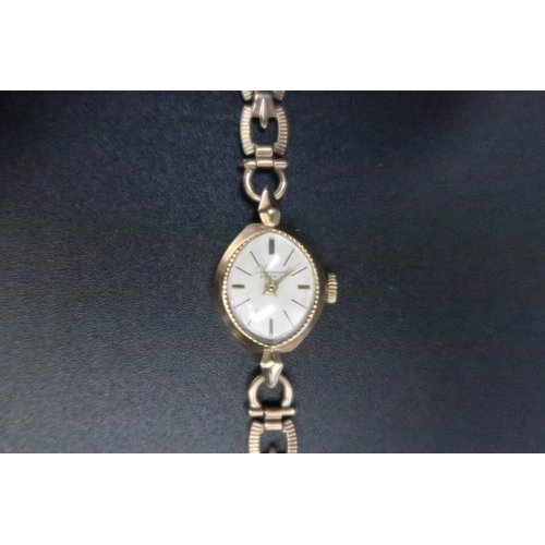 323 - A lady's Accurist, 9ct gold cased cocktail watch, the signed dial with baton numerals and having tex... 