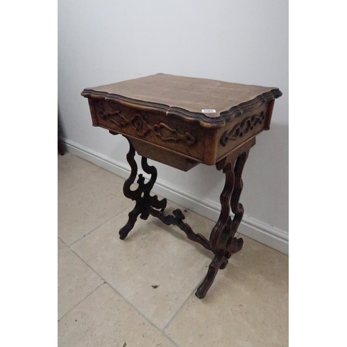 593 - A 19th century walnut work table with a marble interior