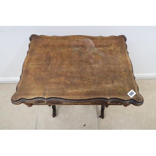 593 - A 19th century walnut work table with a marble interior