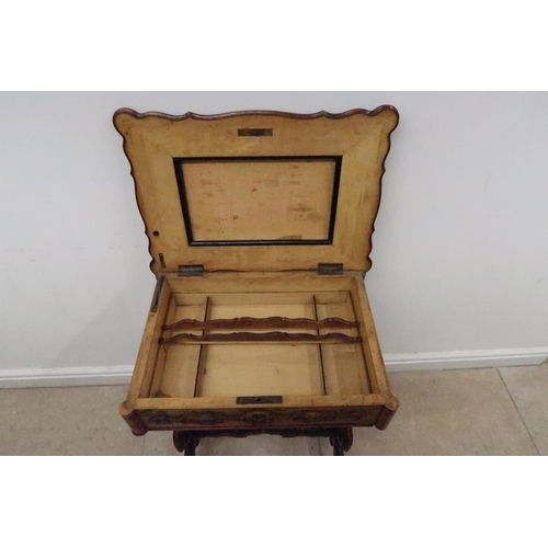 593 - A 19th century walnut work table with a marble interior