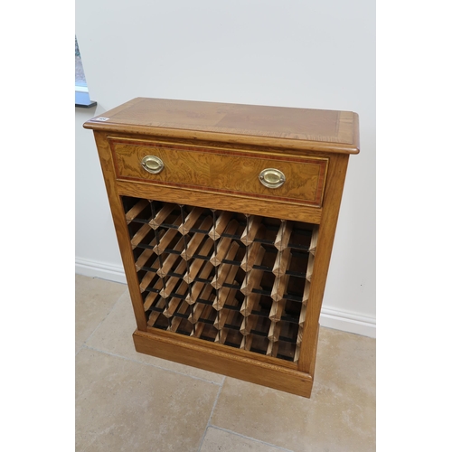 604 - An oak 36 bottle wine rack, 70cm wide x 94cm high