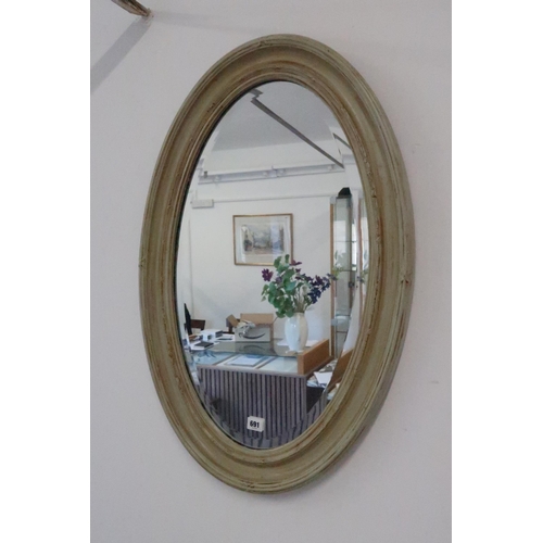 691 - A modern oval mirror - 80cm