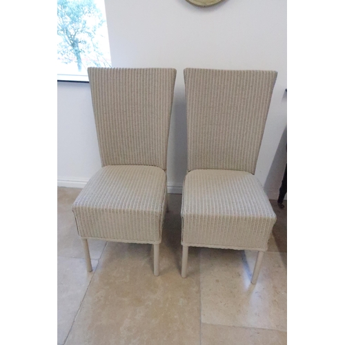 695 - A pair of Lloyd Loom single chairs