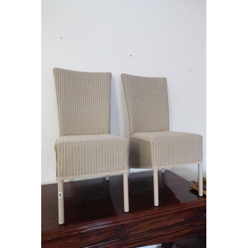 695 - A pair of Lloyd Loom single chairs