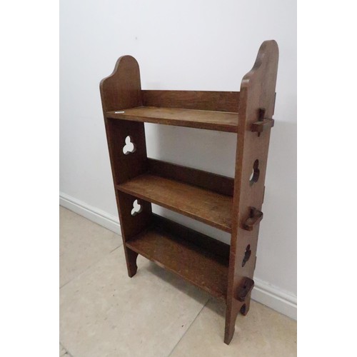 590 - An Arts & Crafts oak bookcase - Height 97cm x Width 60cm x Depth 21cm