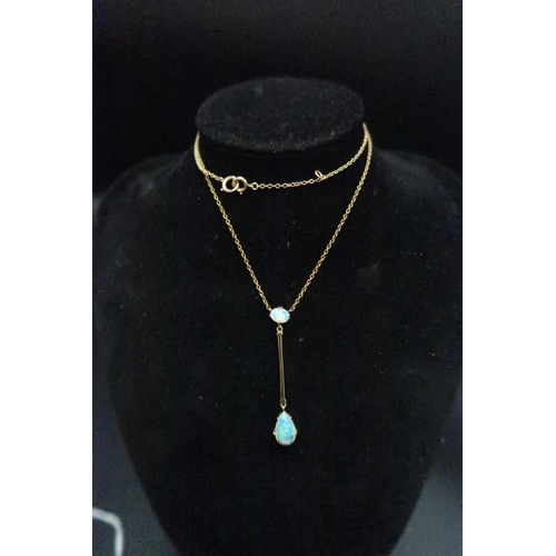 234 - A pretty 14ct (tested) opal set drop pendant on a stamped 9ct yellow gold chain - approx total weigh... 