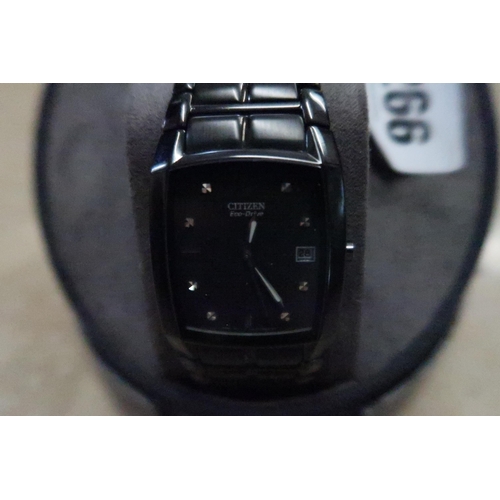 266 - A Citizen Eco-Drive wristwatch, the black rectangular, signed dial, with baton markers, date apertur... 