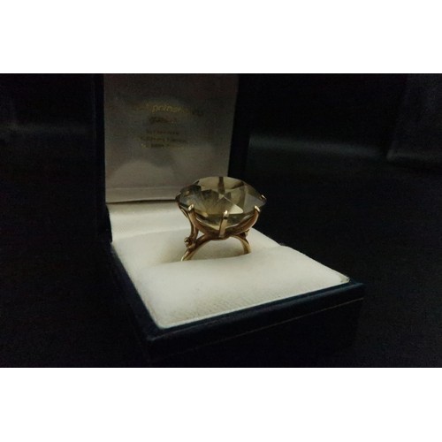 123 - A vintage 9ct gold and large and impressive smoky quartz dress ring, the stone of approximately 18.5... 