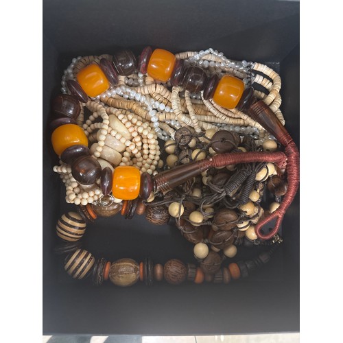 93 - A quantity of yellow metal costume jewellery, beads and necklaces, to include a Michael Kors tortois... 