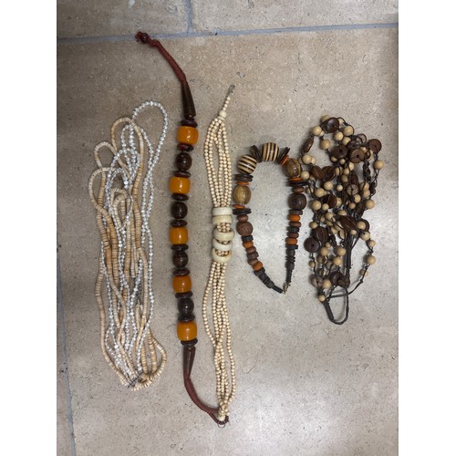 93 - A quantity of yellow metal costume jewellery, beads and necklaces, to include a Michael Kors tortois... 