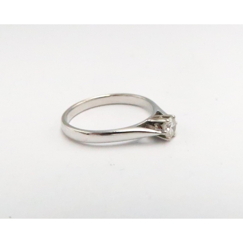  An 18ct white gold and diamond solitaire ring, diamond of approximately 0.25ct, ring size R/S, 3.9g.