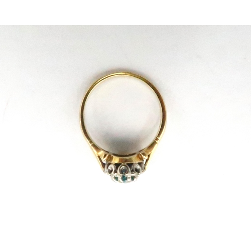  An 18ct gold oval zircon and single cut diamond cluster ring. Size N. Weight 3.92 grams.