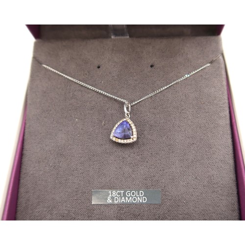  An 18ct white gold triangular Tanzanite and diamond pendant on an 18ct gold chain - approx weight 3.... 