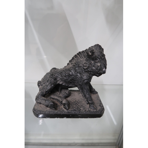  A carved black soapstone wild boar, or possibly sheep, in the Renaissance style, on naturalistic rec... 