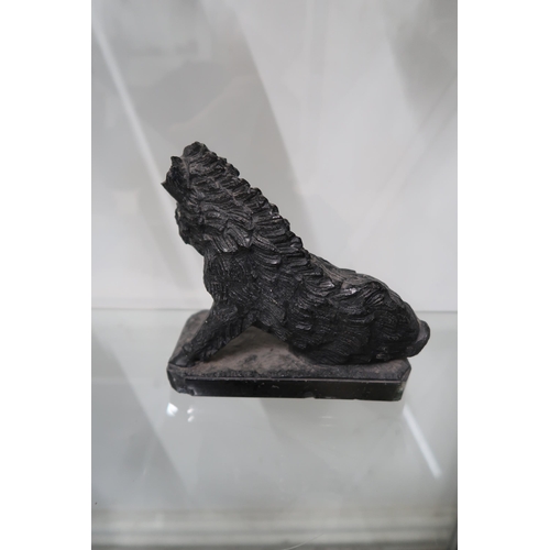  A carved black soapstone wild boar, or possibly sheep, in the Renaissance style, on naturalistic rec... 