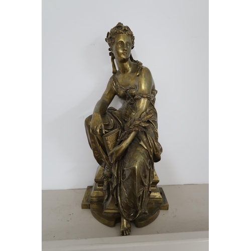  A gilt metal (possibly bronze) allegorical figure of History, modelled seated on a stepped base, hol... 