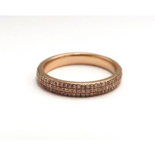  An 18ct gold three row brilliant cut diamond eternity ring. Size M 1/2. Weight 3.52 grams. Estimated... 