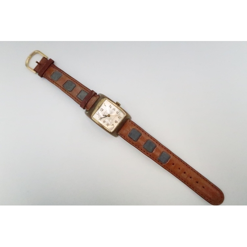 256 - A vintage Trafalgar, manual wind wristwatch, the signed rectangular dial with Arabic numerals and mi... 