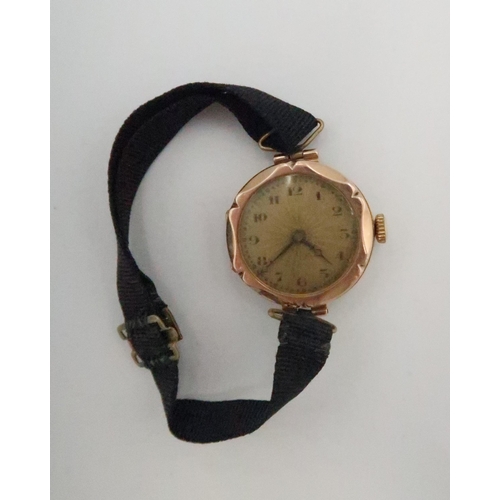 260 - A lady's, 9ct gold cased, vintage watch, the sunburst engraved dial with Arabic numerals, minute tra... 