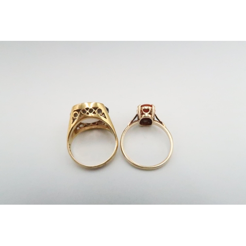 38 - Two 9ct gold dress rings. To include one set with smokey quartz Size M. One with a shell cameo size ... 