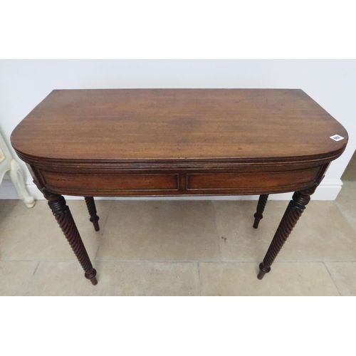 662 - An early 19th century mahogany fold over tea table on ornate turned legs, with nice patina, 91cm wid... 