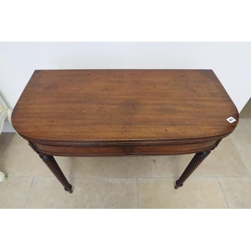 662 - An early 19th century mahogany fold over tea table on ornate turned legs, with nice patina, 91cm wid... 